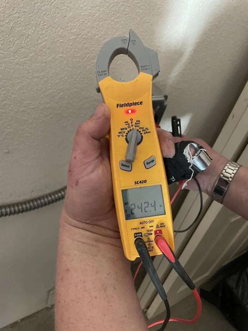 Voltage testing with clamp meter during Whole House Surge Protector in Long Beach